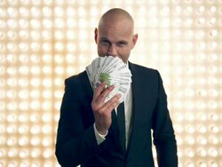 Man with money in front of lightwall Stock Footage