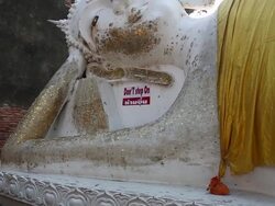 Big Reclining Buddha Statues in temple, pan shot Stock Footage