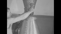 Employee at US Mint in Philadelphia cleaning newly made coins in vat News Clip