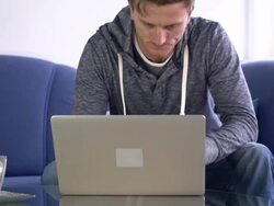 HD: Man Awakes And Start Using Laptop Stock Footage