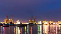 Timelapse Cargo ship loading goods at night Stock Footage