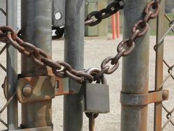 Padlock, locked gate. Secured area with fence. Stock Footage