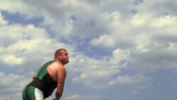 A male athlete throws a javelin into the air. Stock Footage