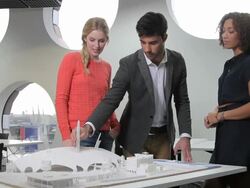 Architects giving presentation and studying maquette Stock Footage