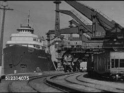 1947: PORT OF CLEVELAND: OHIO: WS Large cranes unloading cargo (iron ore) from cargo ship Frank Furnell. VS Male Captain standing on walkway overseeing cranes. Delivery, shipment, harbor, OH Instructional Video