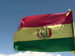 CU of Bolivian national flag, La Tricolor, in the wind, blue sky with clouds, shot on Lake Titicaca, Bolivia Stock Footage