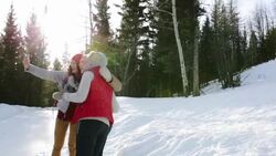 Friends taking selfie with camera phone in snowy field Stock Footage