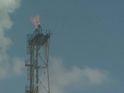 Flame boom and pilot light on oil production platform, Australia Stock Footage
