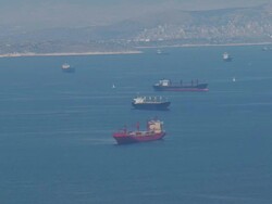 MS AERIAL Shot of many freighters and sailboats on ocean / Piraeus, Peloponnese, Greece Stock Footage