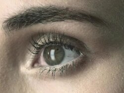 Young woman blinking, close up Stock Footage