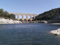 MS View of Roman aqueduct near by river / Vers-Pont-du-Gard, Provence ,France Stock Footage