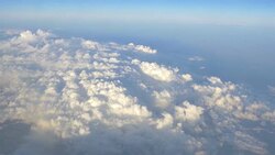 Aerial shot above the clouds in 4K Stock Footage