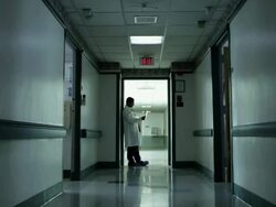 Male doctor standing in hospital corridor Stock Footage