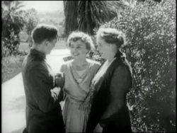 Helen Keller hugs her brother and mother after which he finger spells in her hand as their mother, Kate, watches. News Clip