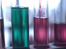 Test tubes with brightly coloured fluids Stock Footage