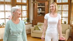 LD Senior woman doing weight exercises with nurse supervision Stock Footage