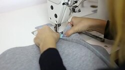 Young woman designer working at sewing machine. Stock Footage