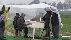 CLEAN : Ai Weiwei holds piano performance at Greek border News Clip