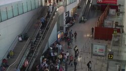 Passengers taking the escalators to the departure gates at Terminal 1D, the domestic departure terminal at the Delhi Airport Stock Footage
