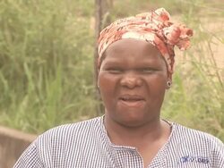 African lady looking at Camera - HD & PAL Stock Footage