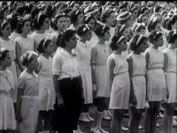 FOURTEENTH OF JULY - LAST YEAR AND THIS - News Clip