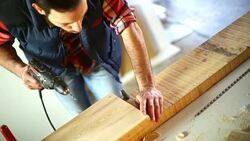 Drilling holes in a wood plank. Stock Footage