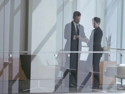  WS Business associates looking at electronic tablet, then shaking hands and leaving, seen through interior windows / Seattle, Washington, United States Stock Footage