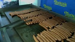 CLEAN: 'Black widow' hot dog champ eats age in dog News Clip