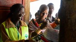 CLEAN : Maasai men and women vote News Clip
