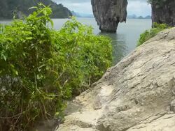 panning : Ko Tapu island in the summer and cloudy sky. Stock Footage