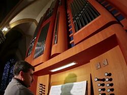 MS TD Organist looking in music book and playing organ   / Saarburg, Rhineland-Palatinate, Germany Stock Footage