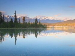 Mountain reflection in lake Stock Footage