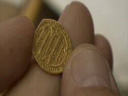 CU fingers holding ancient gold coin, Syria (sound available) Stock Footage