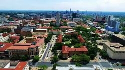 Aerial Over University of Texas Campus UT Clock Tower Austin Texas Skyline Stock Footage