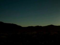 Timelapse day to night mountainous desert with stars Stock Footage