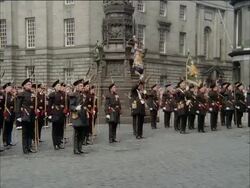 The Queen and Duke of Edinburgh leave St Giles Cathedral.  The Queens escort is the Royal Company of Archers, her own bodyguards whilst in Scotland, Scotland, UK Stock Footage