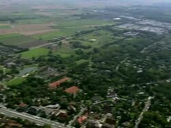 WS AERIAL PAN View of people enjoying at beach near city / Flanders, Belgium Stock Footage