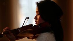 Woman playing violin Stock Footage