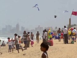 WS Shot of Boys Kites flying on sky with people having fun at beach / Negombo, Sri Lanka Stock Footage