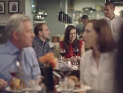 MS R/F People having food in restaurant, waiter serving food Stock Footage