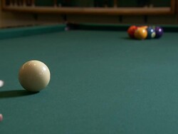 Medium Close Up static - A pool cue strikes the cue ball,  knocking it into the racked billiard balls /  Wisconsin, United States Stock Footage