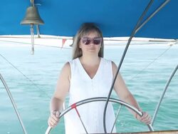 Young woman driving a yacht Stock Footage