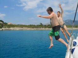 HD SLOW MOTION: Men Having Fun While Jumping Into Water Stock Footage