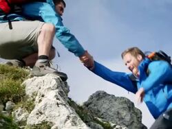 Backpacker climbing a mountain Stock Footage