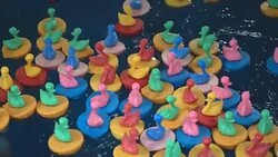 colorful rubber duck toys on water Stock Footage