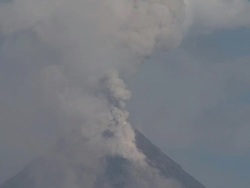 Ash erupts from the crater of large volcano into the sky, Philippines, Dec 2009 Stock Footage