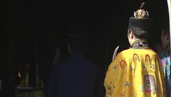 Taoists monks stand before an altar that smokes with incense in Beijing. Stock Footage