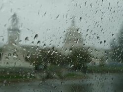 Rain on car window in front of US Capitol Stock Footage