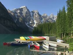 MS View of small boat harbour at Moraine Lake in ten peaks valley at nationalpark / Lake Louise, Alberta, Canada Stock Footage