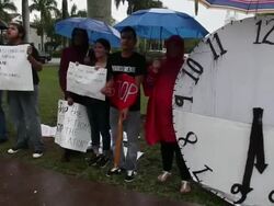 Long tracking shot of protesters chanting pan to right Immigration Activists Protest Outside Of Marco Rubio Fundraiser at Biltmore Hotel on April 05, 2013 in Miami, Florida (Footage by Getty Images)Immigration Activists Protest Outside Of Marco Rubio Fundr Stock Footage